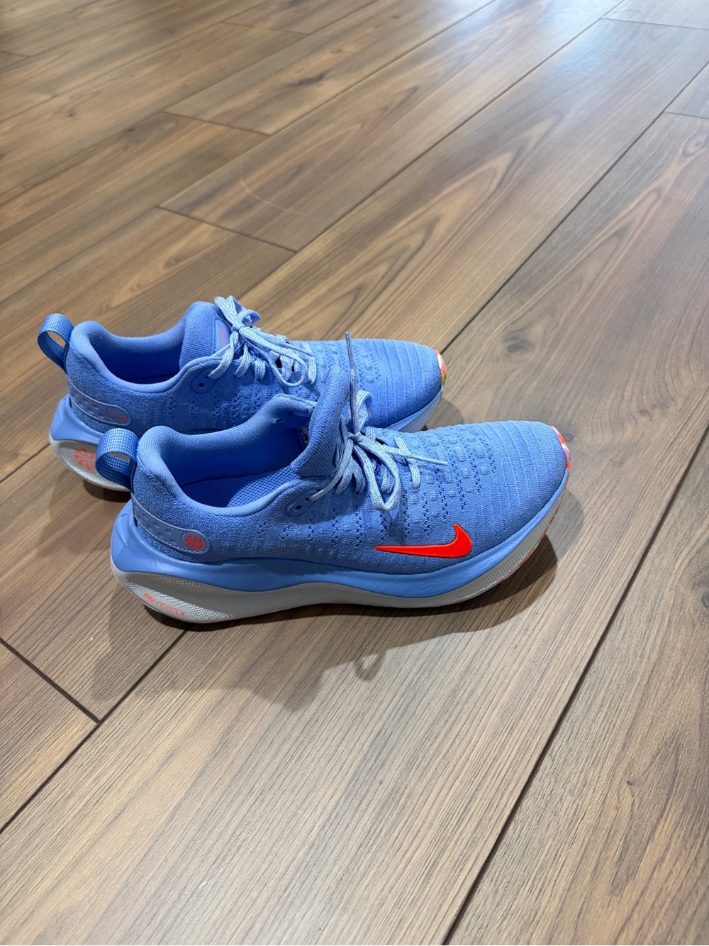Nike Sky Blue Running Sneakers with Bright Orange Swoosh